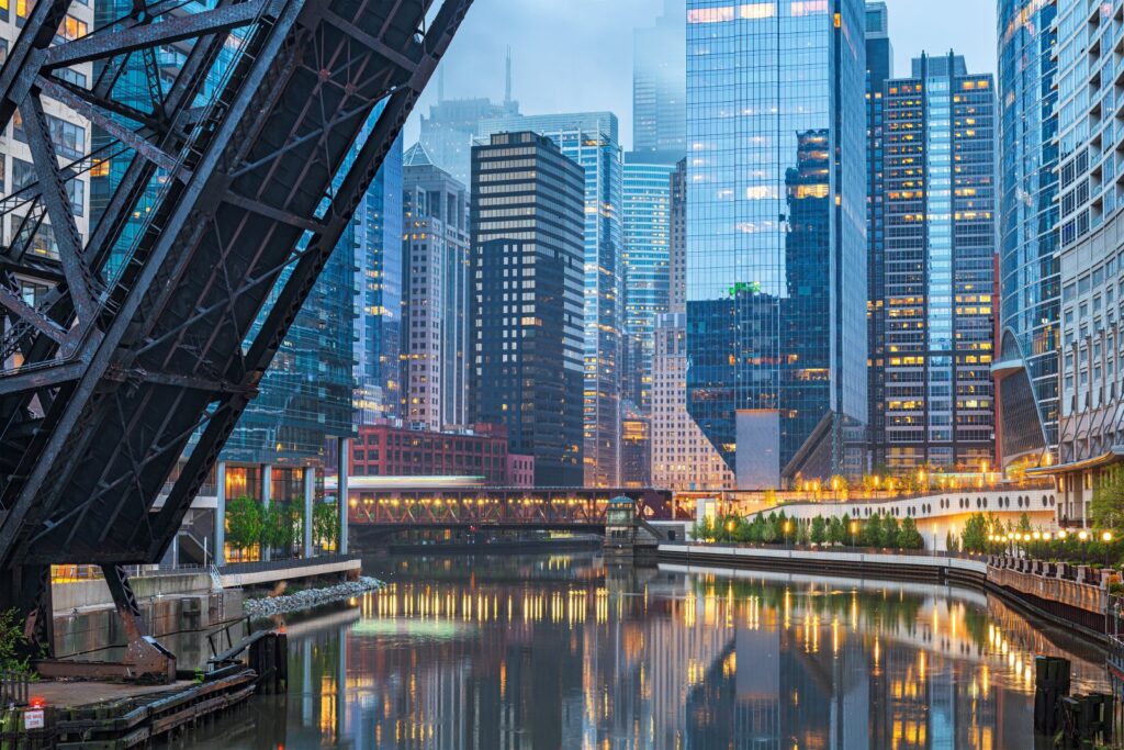 Chicago, Illinois, USA cityscape on the river at twilight.